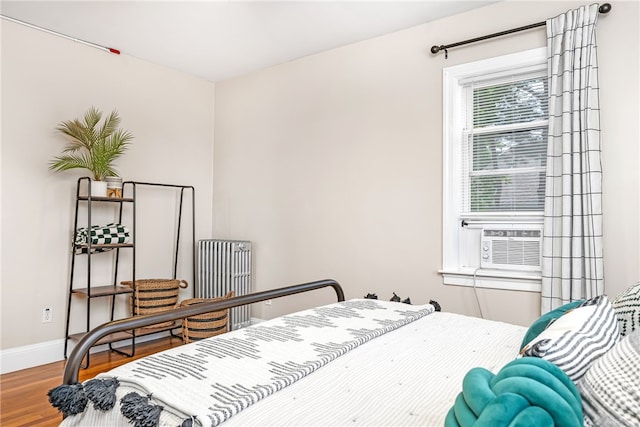 165 Wentworth Ave Unit 2E, Cranston, RI 02905 - bedroom featuring wood finished floors, baseboards, and cooling unit