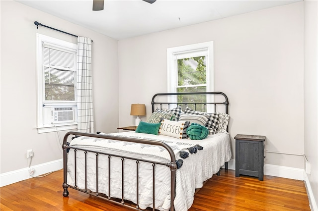 165 Wentworth Ave Unit 2E, Cranston, RI 02905 - bedroom featuring baseboards, wood finished floors, a ceiling fan, and cooling unit