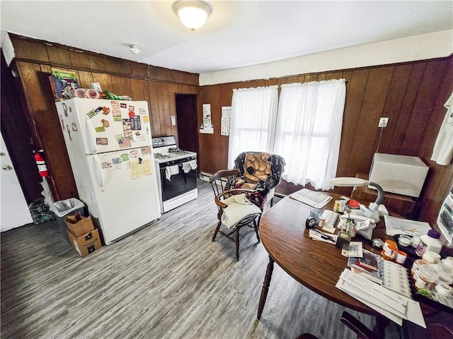 106 Baxter St, Pawtucket, RI 02861 - kitchen featuring white appliances, wooden walls, wood finished floors, and a baseboard radiator