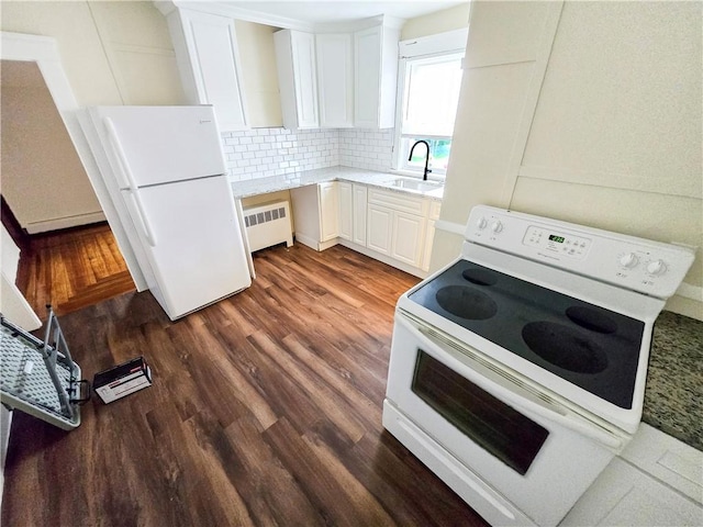 106 Baxter St, Pawtucket, RI 02861 - kitchen featuring white appliances, radiator, a sink, tasteful backsplash, and dark wood finished floors