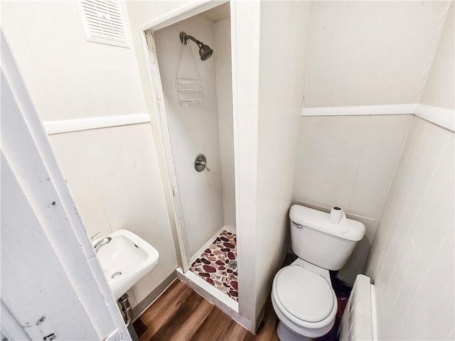 106 Baxter St, Pawtucket, RI 02861 - full bathroom with a stall shower, toilet, and wood finished floors