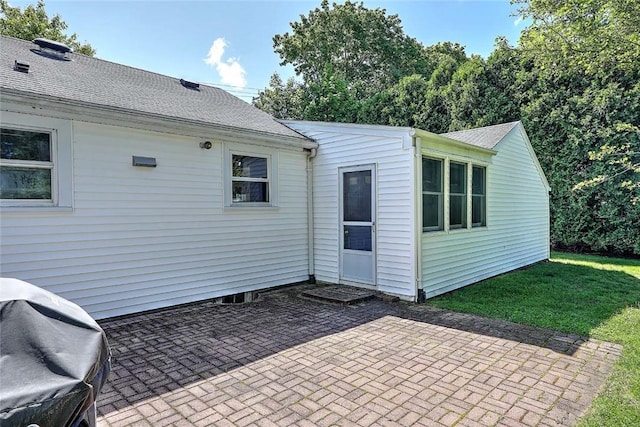 9 Roberta Dr, Barrington, RI 02806 - rear view of house with a patio area, a shingled roof, and a lawn