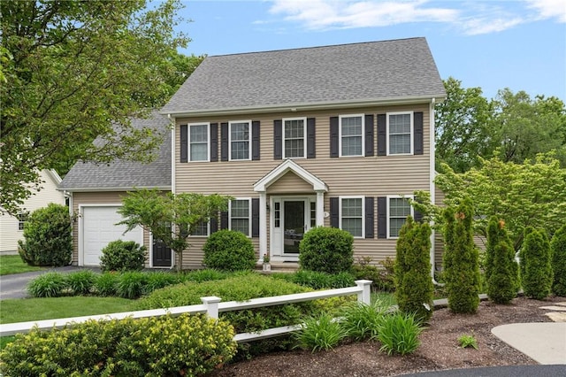 3 Berm Dr, Cumberland, RI 02864 - colonial-style house with asphalt driveway, an attached garage, and a shingled roof