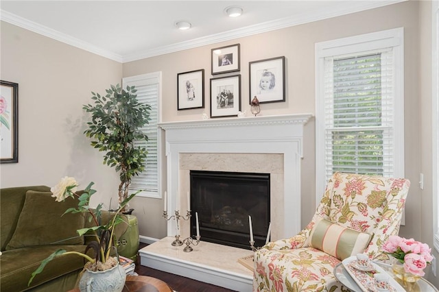 3 Berm Dr, Cumberland, RI 02864 - living room with ornamental molding, a fireplace with raised hearth, wood finished floors, and baseboards