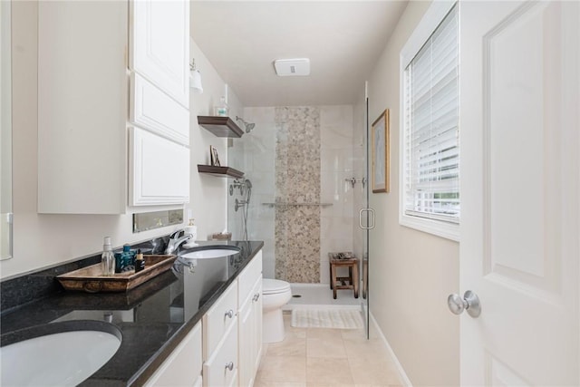 3 Berm Dr, Cumberland, RI 02864 - bathroom with a stall shower, double vanity, toilet, tile patterned flooring, and baseboards