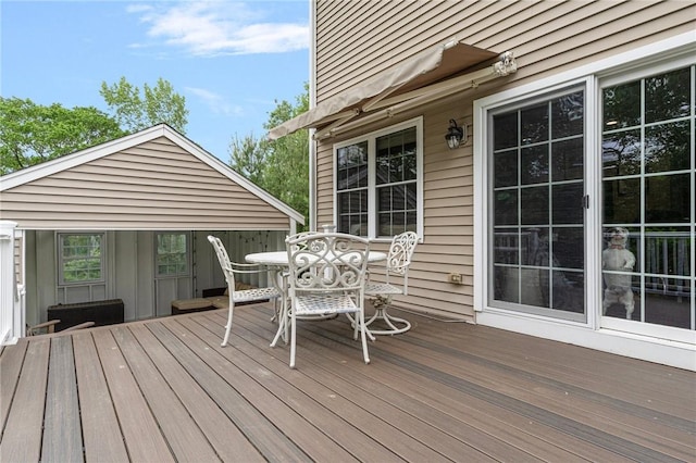 3 Berm Dr, Cumberland, RI 02864 - wooden terrace with outdoor dining area