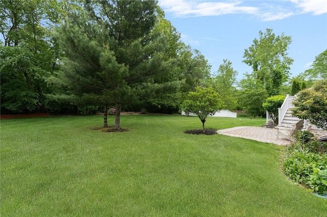 3 Berm Dr, Cumberland, RI 02864 - view of grassy yard with a patio area and stairs