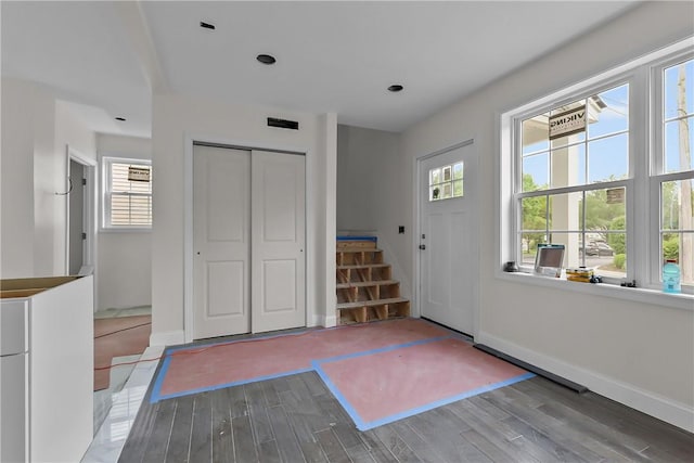 0 Rugby St, Providence, RI 02905 - foyer featuring wood finished floors, stairway, plenty of natural light, and baseboards