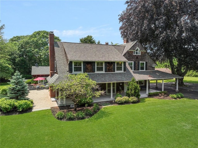 211 Rumstick Rd, Barrington, RI 02806 - view of front of home featuring a front yard, a chimney, and a porch