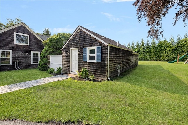 211 Rumstick Rd, Barrington, RI 02806 - shingle-style home with a front lawn, an outbuilding, and a playground
