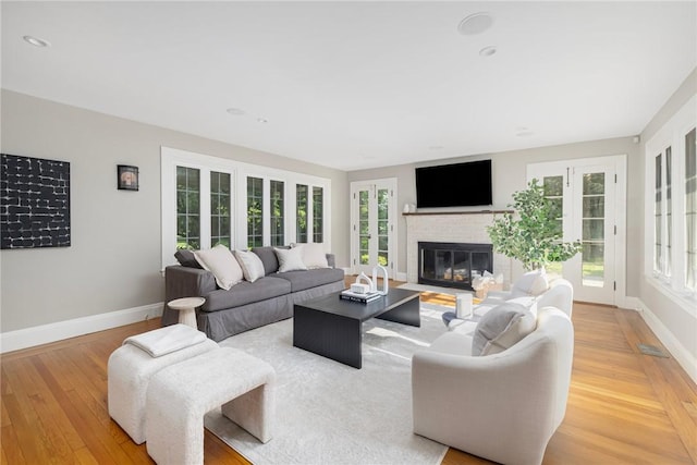211 Rumstick Rd, Barrington, RI 02806 - living area with light wood-style floors, plenty of natural light, and a fireplace