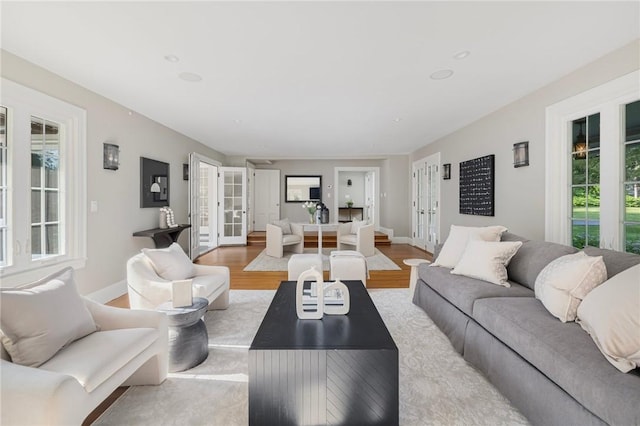 211 Rumstick Rd, Barrington, RI 02806 - living room with french doors, light wood-style flooring, and healthy amount of natural light