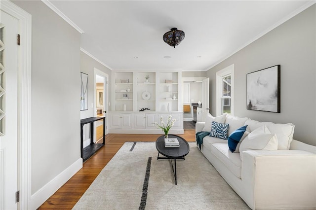 211 Rumstick Rd, Barrington, RI 02806 - living area with wood finished floors, crown molding, and built in features