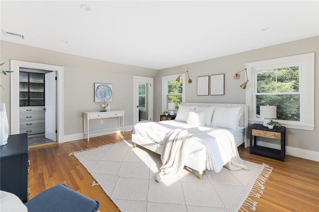 211 Rumstick Rd, Barrington, RI 02806 - bedroom with multiple windows and wood finished floors