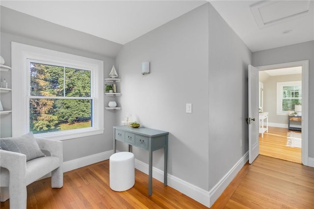 211 Rumstick Rd, Barrington, RI 02806 - living area with light wood-style flooring and attic access