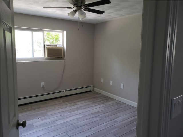 56 River St Unit 23, West Warwick, RI 02893 - spare room with a baseboard radiator, ceiling fan, wood finished floors, cooling unit, and baseboards