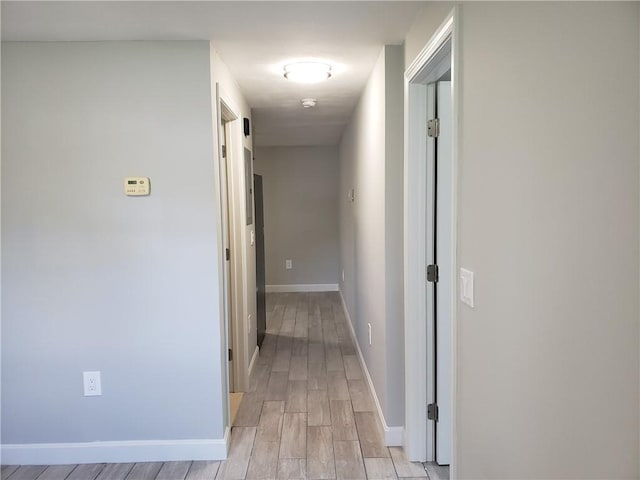 56 River St Unit 23, West Warwick, RI 02893 - corridor with light wood-type flooring and baseboards