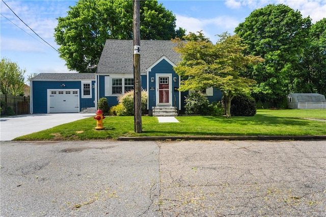 35 Jenks St, East Providence, RI 02914 - view of front of house with an attached garage, driveway, a front yard, and a shingled roof