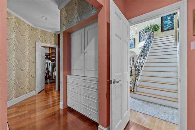 33 Courageous Cir, Bristol, RI 02809 - corridor featuring wood finished floors, stairs, baseboards, wallpapered walls, and recessed lighting