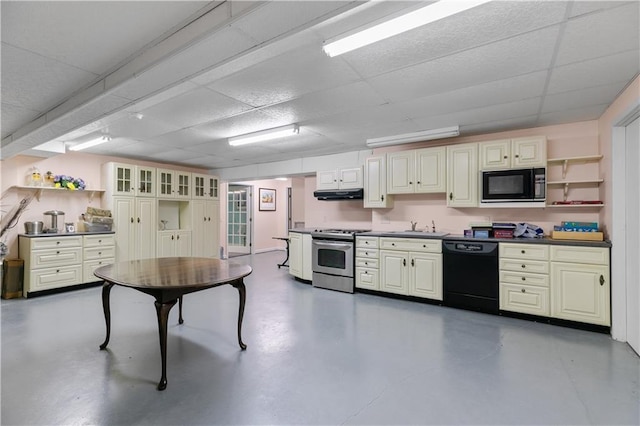 33 Courageous Cir, Bristol, RI 02809 - kitchen featuring black appliances, open shelves, under cabinet range hood, finished concrete floors, and a paneled ceiling