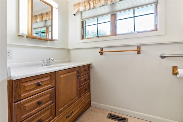 75 Circuit Dr, Narragansett, RI 02882 - bathroom featuring plenty of natural light, vanity, tile patterned floors, and baseboards