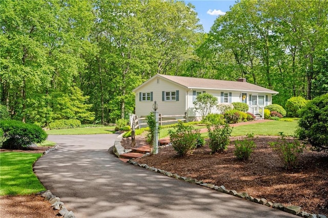 70 High Ridge Dr, Cumberland, RI 02864 - view of front of property featuring a chimney, a front lawn, and driveway