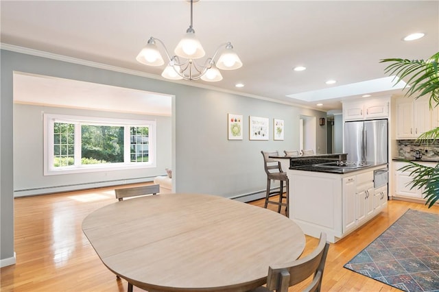 70 High Ridge Dr, Cumberland, RI 02864 - dining area with a baseboard radiator, baseboard heating, a chandelier, ornamental molding, and light wood-style flooring