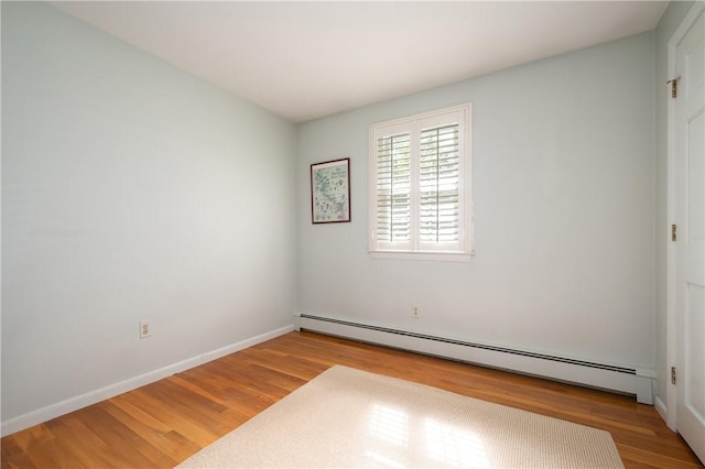 70 High Ridge Dr, Cumberland, RI 02864 - empty room featuring baseboard heating, wood finished floors, and baseboards