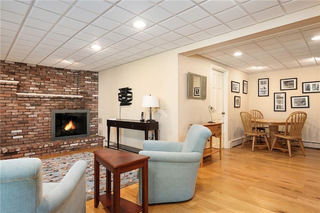 70 High Ridge Dr, Cumberland, RI 02864 - living area featuring wood finished floors, a fireplace, recessed lighting, and a paneled ceiling