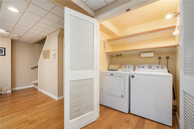 70 High Ridge Dr, Cumberland, RI 02864 - washroom featuring light wood-type flooring, separate washer and dryer, baseboards, and a baseboard heating unit