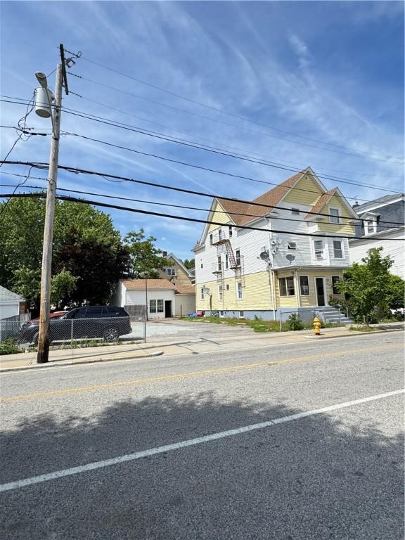 143 Mineral Spring Ave, Pawtucket, RI 02860 - view of asphalt road featuring sidewalks and curbs
