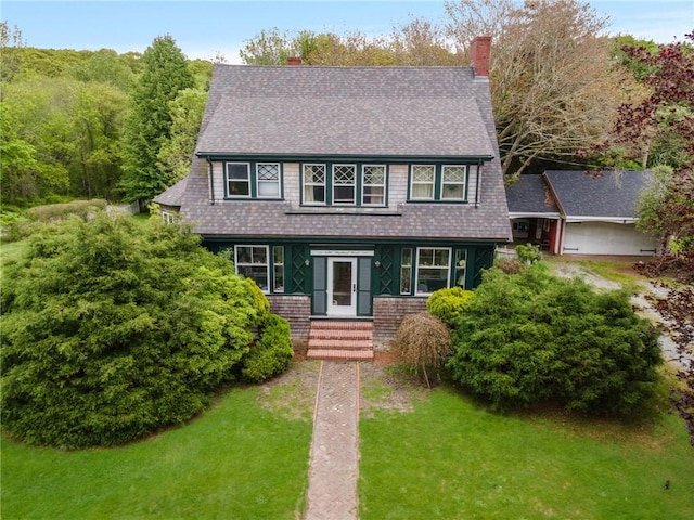 130 Highland Rd, Tiverton, RI 02878 - view of front facade with a chimney, a front lawn, and a shingled roof