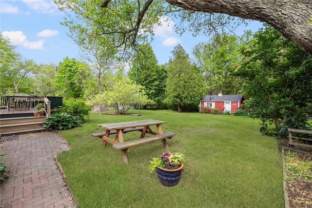 130 Highland Rd, Tiverton, RI 02878 - view of grassy yard featuring a wooden deck, an outdoor structure, and view of wooded area