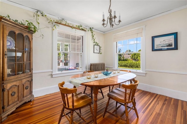 130 Highland Rd, Tiverton, RI 02878 - dining area featuring a chandelier, healthy amount of natural light, wood finished floors, ornamental molding, and radiator
