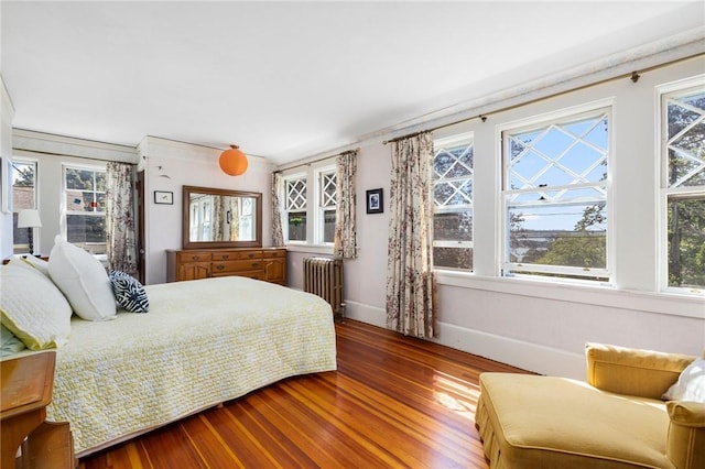 130 Highland Rd, Tiverton, RI 02878 - bedroom featuring radiator heating unit, wood finished floors, multiple windows, and ornamental molding