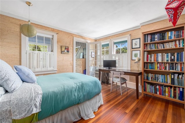 130 Highland Rd, Tiverton, RI 02878 - bedroom with multiple windows, wood-type flooring, brick wall, and a desk