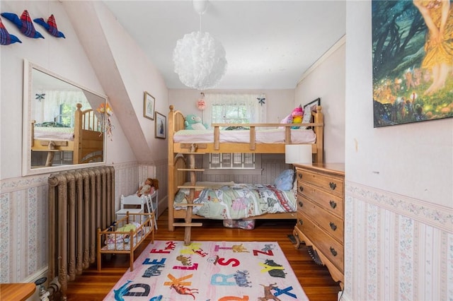 130 Highland Rd, Tiverton, RI 02878 - bedroom with radiator heating unit, wood finished floors, and a chandelier