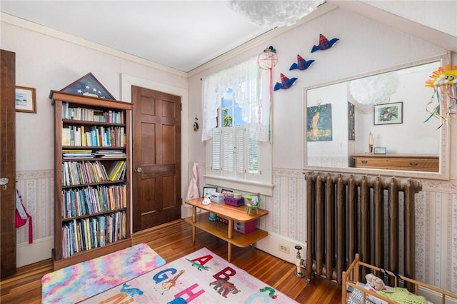 130 Highland Rd, Tiverton, RI 02878 - rec room with radiator heating unit, wood finished floors, ornamental molding, and wallpapered walls