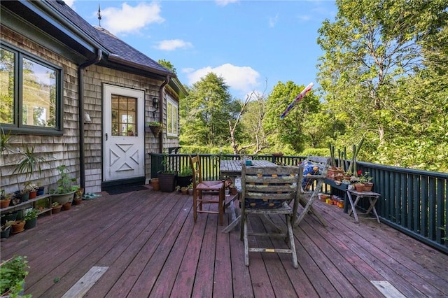 130 Highland Rd, Tiverton, RI 02878 - wooden terrace featuring outdoor dining space and view of scattered trees