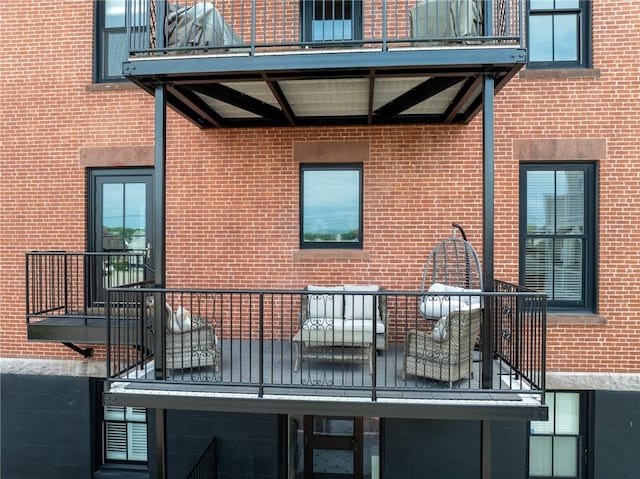 423 Hope St Unit C, Bristol, RI 02809 - view of side of property featuring a balcony and brick siding