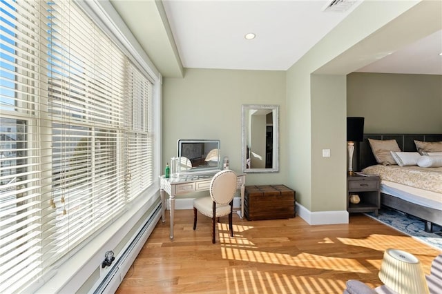 423 Hope St Unit C, Bristol, RI 02809 - bedroom with light wood finished floors, baseboards, and baseboard heating