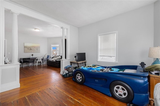 9 Sackett St, Providence, RI 02907 - living area with decorative columns and wood-type flooring