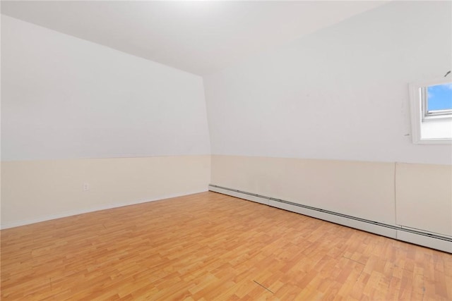 9 Sackett St, Providence, RI 02907 - empty room featuring baseboard heating, light wood-type flooring, and baseboards