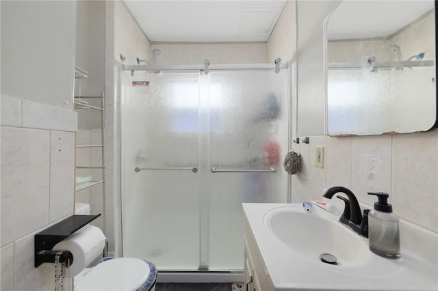 9 Sackett St, Providence, RI 02907 - full bath featuring tile walls, a shower stall, toilet, vanity, and a baseboard radiator