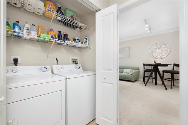 1000 Providence Pl Unit 142, Providence, RI 02903 - washroom with washing machine and clothes dryer, light colored carpet, ornamental molding, and track lighting