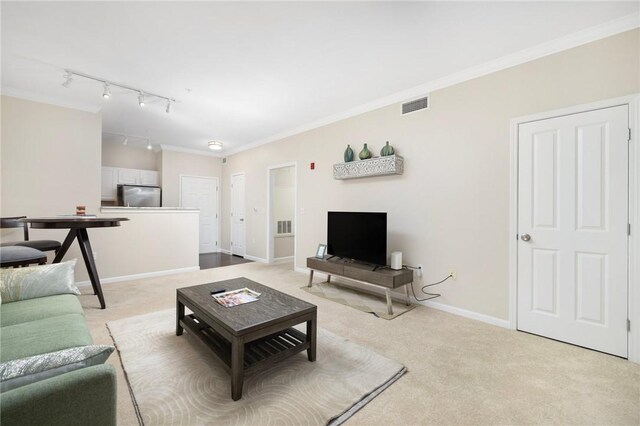 1000 Providence Pl Unit 142, Providence, RI 02903 - living area with light colored carpet, rail lighting, ornamental molding, and baseboards