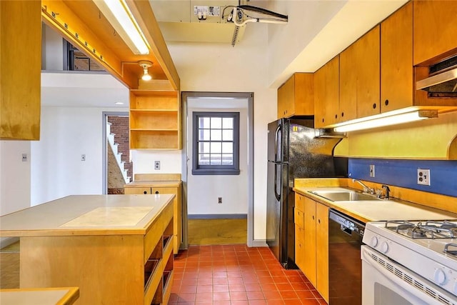 116 Chestnut St Unit G, Providence, RI 02903 - kitchen with black dishwasher, a sink, open shelves, light countertops, and dark tile patterned floors