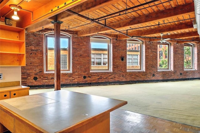 116 Chestnut St Unit G, Providence, RI 02903 - interior space with brick wall, wood ceiling with exposed beams, and stainless steel counters