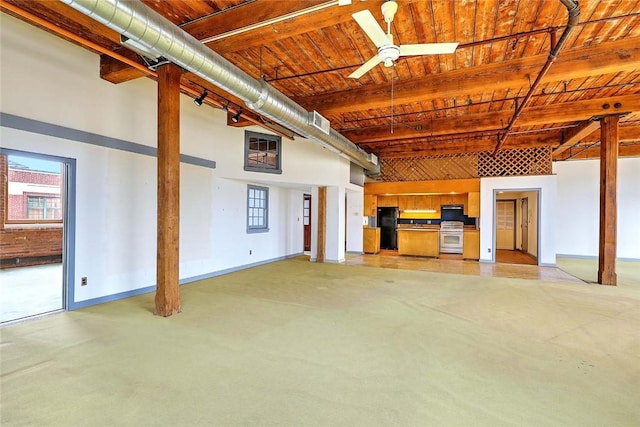 116 Chestnut St Unit G, Providence, RI 02903 - basement featuring freestanding refrigerator, baseboards, plenty of natural light, and wood ceiling
