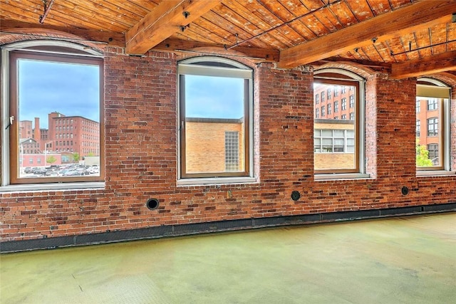 116 Chestnut St Unit G, Providence, RI 02903 - spare room with wooden ceiling with exposed beams and brick wall